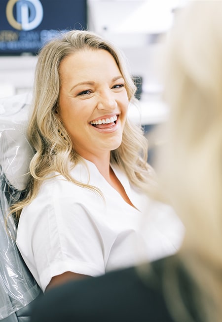 A patient smiling during their dental consultation